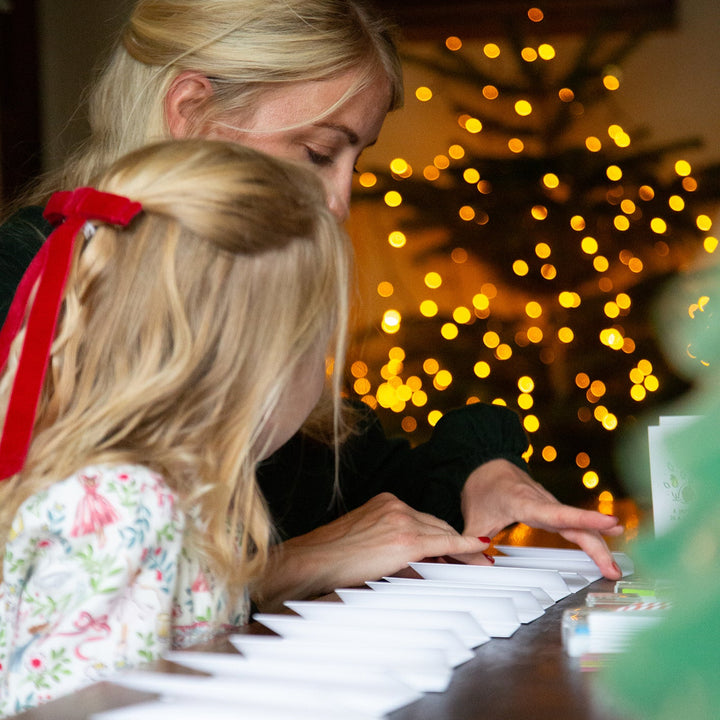 Family making Christmas cards together 
