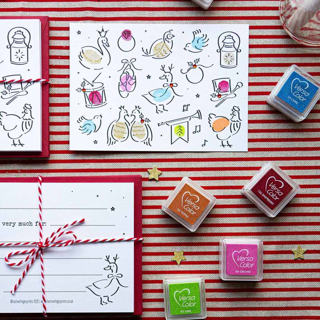 Set of stamps and ink pads on a red and white striped background